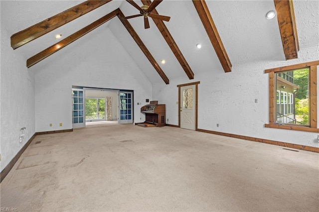 9 Hill Way, Carrollton, VA 23314 - unfurnished living room with beamed ceiling, high vaulted ceiling, carpet flooring, baseboards, and a ceiling fan