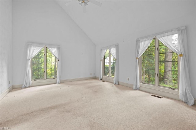 9 Hill Way, Carrollton, VA 23314 - unfurnished living room featuring high vaulted ceiling, carpet floors, a ceiling fan, and baseboards