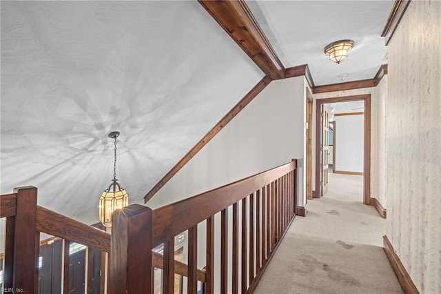 9 Hill Way, Carrollton, VA 23314 - corridor with light carpet, ornamental molding, a chandelier, and an upstairs landing
