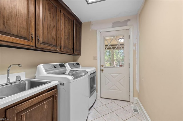 9 Hill Way, Carrollton, VA 23314 - laundry room featuring cabinet space, washer and clothes dryer, light tile patterned floors, and baseboards