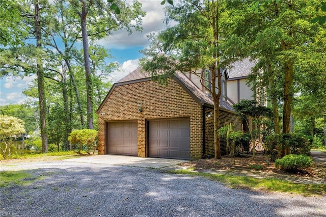 9 Hill Way, Carrollton, VA 23314 - view of home's exterior with brick siding and roof with shingles