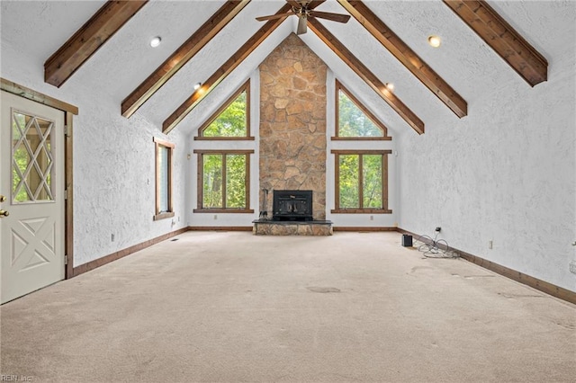 9 Hill Way, Carrollton, VA 23314 - unfurnished living room with carpet floors, beam ceiling, a ceiling fan, a textured wall, and baseboards