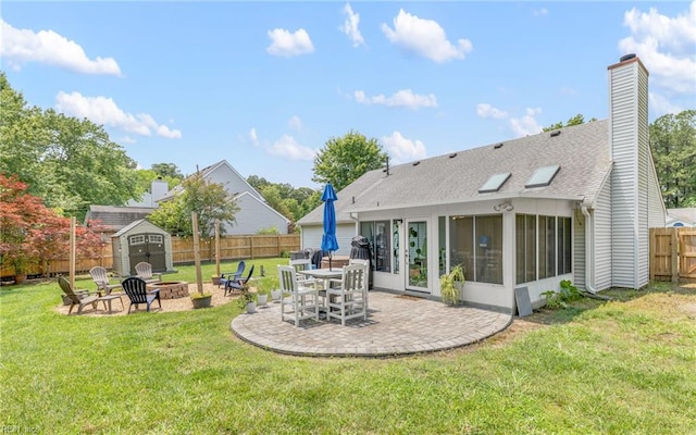 2012 Damascus Ct, Virginia Beach, VA 23453 - back of house featuring a fire pit, a patio, a sunroom, a chimney, and a shingled roof