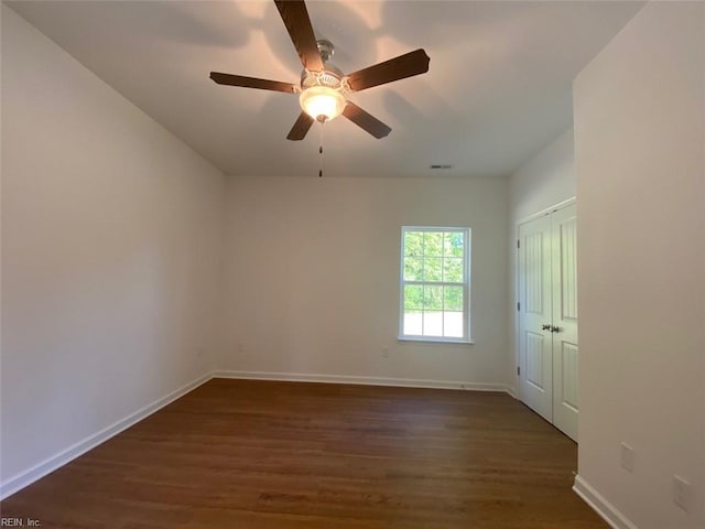 7228 Gates Rd, Suffolk, VA 23437 - unfurnished room with dark wood-style flooring, baseboards, and a ceiling fan