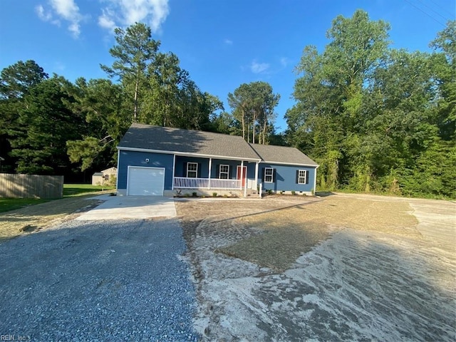 7228 Gates Rd, Suffolk, VA 23437 - ranch-style home with a porch, gravel driveway, and an attached garage