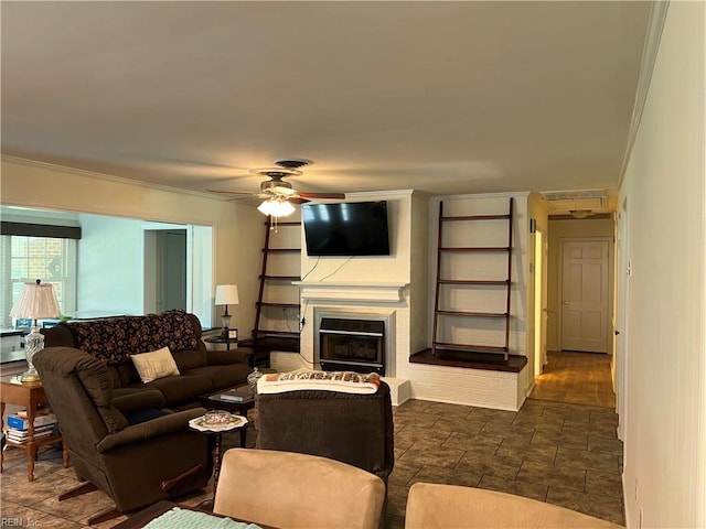 432 Crescent Dr, Franklin, VA 23851 - living area with crown molding, a glass covered fireplace, and a ceiling fan