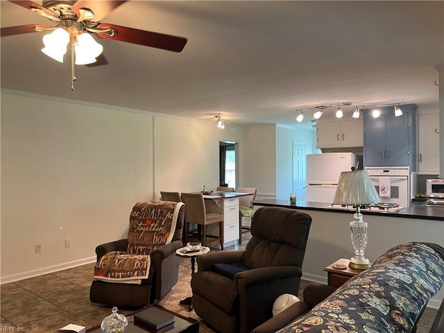 432 Crescent Dr, Franklin, VA 23851 - living room with a ceiling fan, ornamental molding, baseboards, and dark tile patterned floors