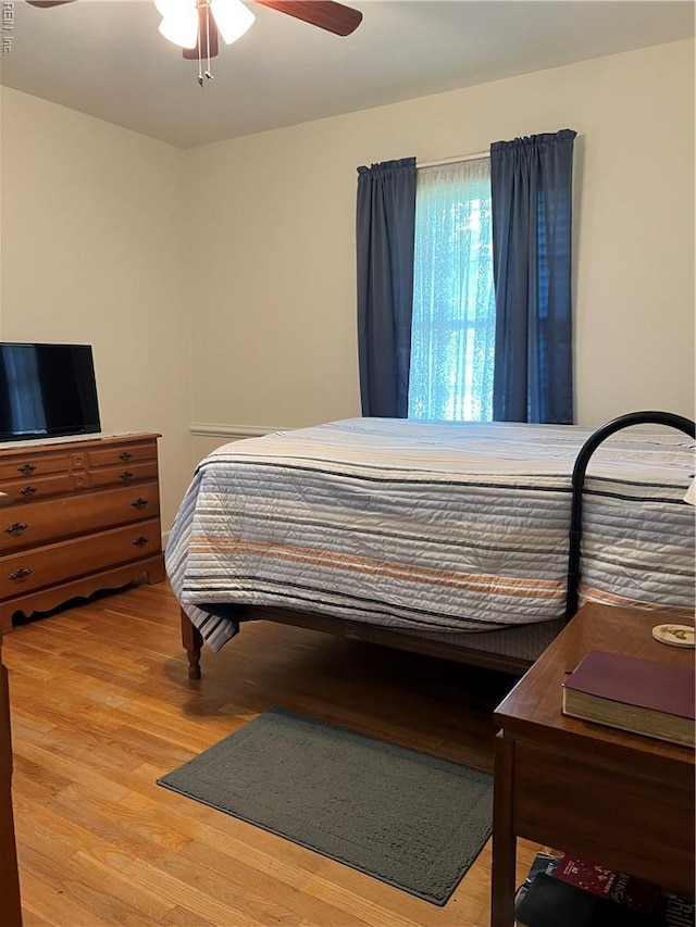 432 Crescent Dr, Franklin, VA 23851 - bedroom with light wood finished floors and ceiling fan