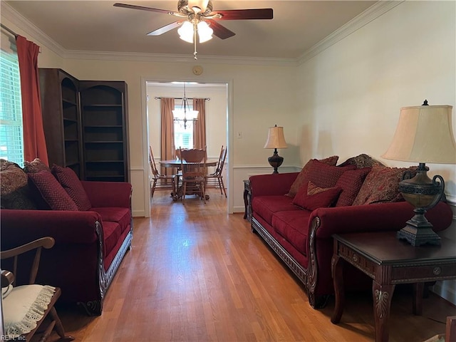 432 Crescent Dr, Franklin, VA 23851 - living area featuring light wood-style flooring, ceiling fan, ornamental molding, and a chandelier