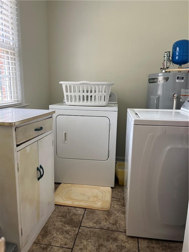 432 Crescent Dr, Franklin, VA 23851 - laundry room with electric water heater, washer and dryer, cabinet space, and tile patterned flooring