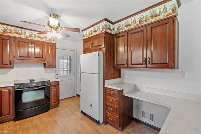 3435 Macdonald Rd, Virginia Beach, VA 23464 - kitchen with freestanding refrigerator, black electric range oven, light countertops, ceiling fan, and light wood-style flooring