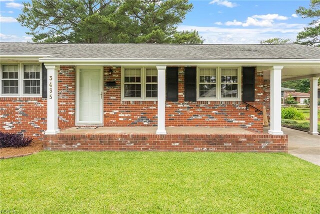 3435 Macdonald Rd, Virginia Beach, VA 23464 - ranch-style home with covered porch, a front lawn, brick siding, and roof with shingles