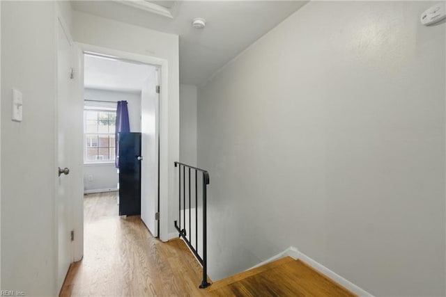 882 Elizabeth Ct, Virginia Beach, VA 23451 - hallway with an upstairs landing, light wood-type flooring, and baseboards