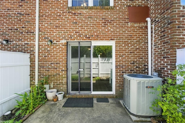 882 Elizabeth Ct, Virginia Beach, VA 23451 - entrance to property with central air condition unit, brick siding, and a patio area