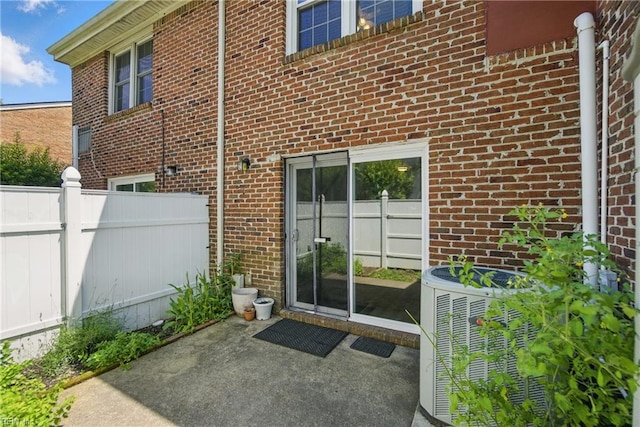 882 Elizabeth Ct, Virginia Beach, VA 23451 - doorway to property with a patio, brick siding, and central air condition unit