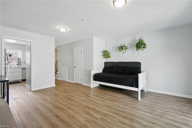 882 Elizabeth Ct, Virginia Beach, VA 23451 - sitting room with light wood-style flooring, baseboards, and stairs