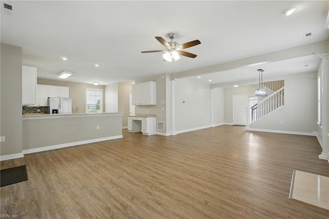 460 Blue Beech Way Unit 963, Chesapeake, VA 23320 - unfurnished living room with light wood-style floors, a ceiling fan, stairs, recessed lighting, and baseboards