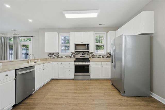 460 Blue Beech Way Unit 963, Chesapeake, VA 23320 - kitchen with stainless steel appliances, decorative backsplash, white cabinetry, light wood-style floors, and recessed lighting