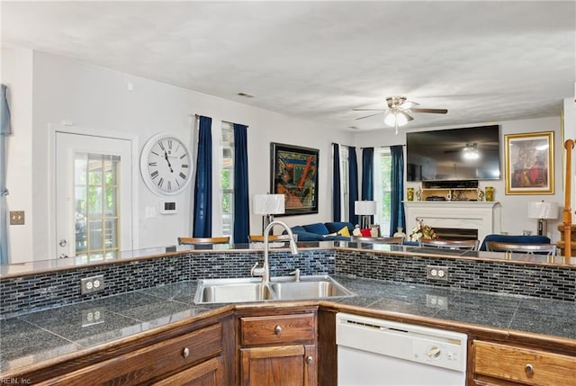 127 Rockland Ter, Suffolk, VA 23434 - kitchen with dishwasher, tile counters, open floor plan, a sink, and decorative backsplash