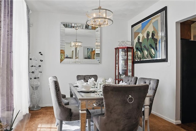 127 Rockland Ter, Suffolk, VA 23434 - carpeted dining area with a chandelier and baseboards