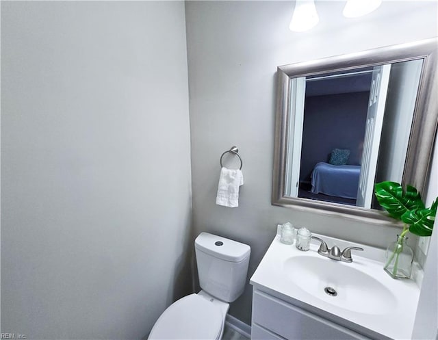 865 Kings Arms Dr, Virginia Beach, VA 23452 - bathroom featuring vanity, toilet, and ensuite bath