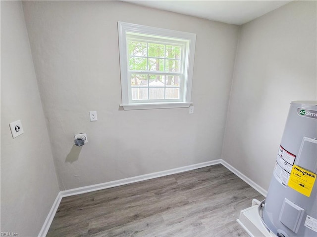 865 Kings Arms Dr, Virginia Beach, VA 23452 - laundry area with electric dryer hookup, water heater, wood finished floors, and baseboards