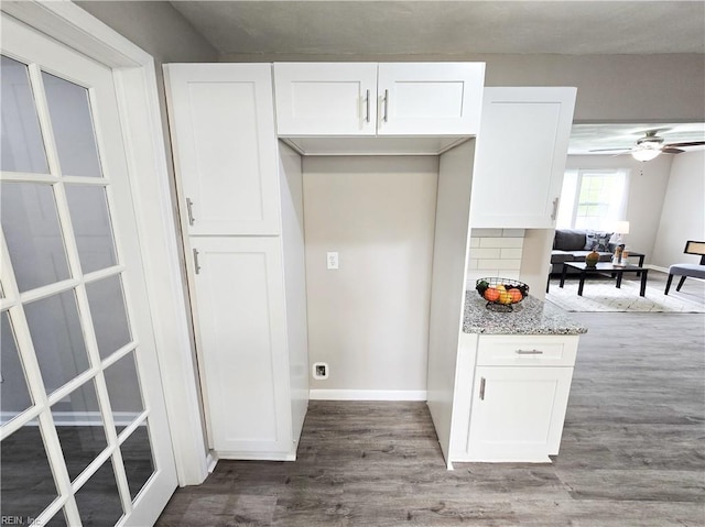865 Kings Arms Dr, Virginia Beach, VA 23452 - kitchen featuring wood finished floors, white cabinets, light stone countertops, baseboards, and a ceiling fan