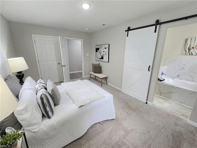865 Kings Arms Dr, Virginia Beach, VA 23452 - bedroom with a barn door, baseboards, connected bathroom, and carpet floors