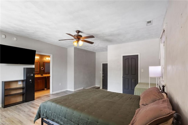2811 Mapleton Ave, Norfolk, VA 23504 - bedroom with light wood-style floors, baseboards, a ceiling fan, and connected bathroom