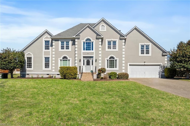 6 Lessies Dr, Poquoson, VA 23662 - view of front facade with a garage, concrete driveway, stucco siding, and a front lawn