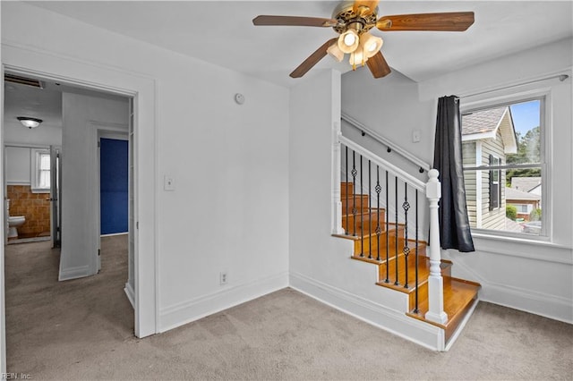 811 Wingfield Ave, Chesapeake, VA 23325 - unfurnished living room featuring light carpet, ceiling fan, baseboards, and stairs