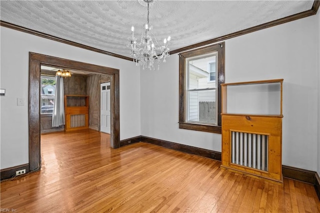 811 Wingfield Ave, Chesapeake, VA 23325 - unfurnished room featuring a chandelier, baseboards, hardwood / wood-style floors, and crown molding