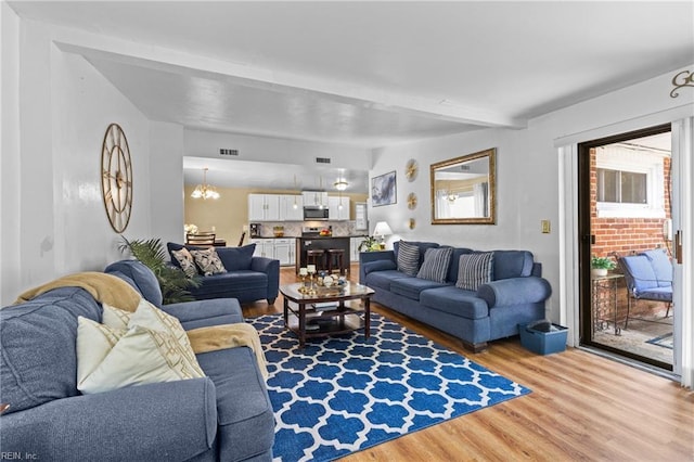 1208 Santeetlah Ave, Chesapeake, VA 23325 - living room with wood finished floors, a chandelier, and beam ceiling