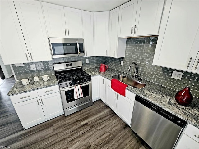 619 City Park Ave, Portsmouth, VA 23701 - kitchen with appliances with stainless steel finishes, a sink, and white cabinetry