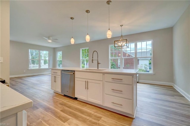515 Buckroe Ave, Hampton, VA 23664 - kitchen with dishwasher, a sink, plenty of natural light, and baseboards