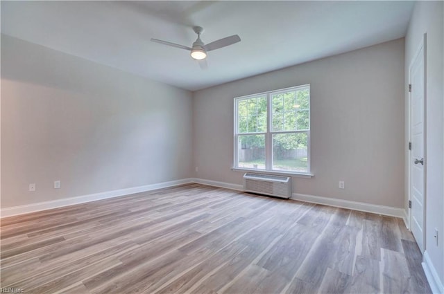 515 Buckroe Ave, Hampton, VA 23664 - empty room featuring light wood-type flooring, ceiling fan, baseboards, and a wall mounted air conditioner