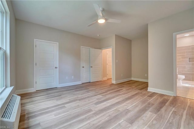 515 Buckroe Ave, Hampton, VA 23664 - unfurnished bedroom featuring light wood-type flooring, baseboards, and ensuite bath