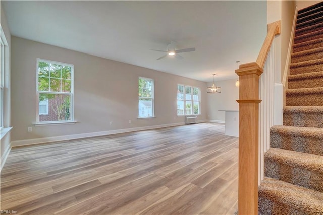 515 Buckroe Ave, Hampton, VA 23664 - unfurnished living room with ceiling fan, light wood finished floors, stairs, and baseboards