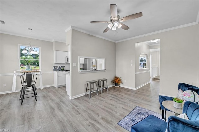 841 Mill Landing Rd, Chesapeake, VA 23322 - sitting room featuring ceiling fan, light wood-style floors, ornamental molding, baseboards, and a chandelier