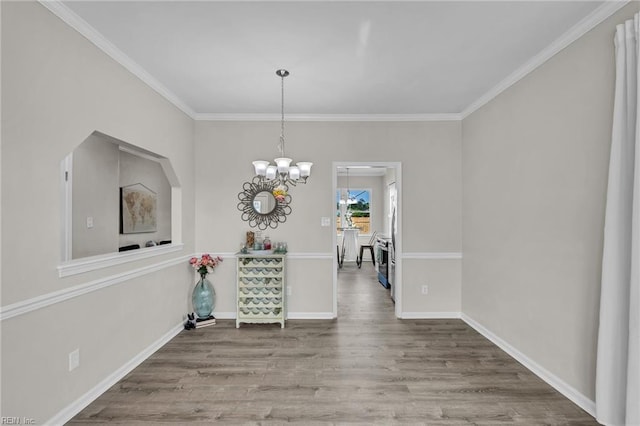 841 Mill Landing Rd, Chesapeake, VA 23322 - dining room featuring wood finished floors, crown molding, a chandelier, and baseboards