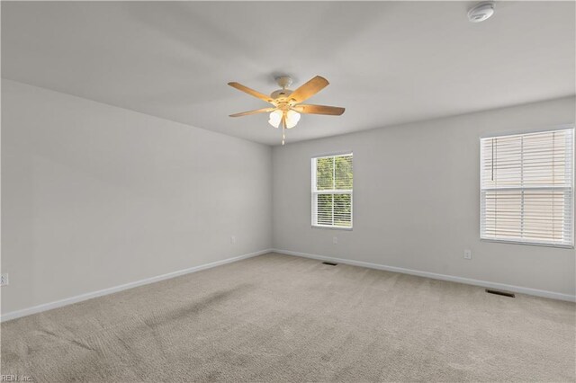 1102 Lakeview Cv, Smithfield, VA 23430 - unfurnished room with baseboards, a ceiling fan, a smoke detector, and light colored carpet