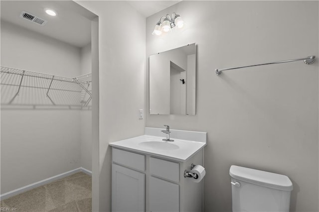 1102 Lakeview Cv, Smithfield, VA 23430 - half bathroom featuring vanity, toilet, baseboards, and a spacious closet