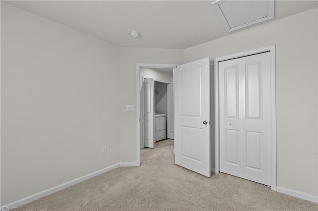 1102 Lakeview Cv, Smithfield, VA 23430 - unfurnished bedroom with light carpet, baseboards, a closet, and washer and dryer