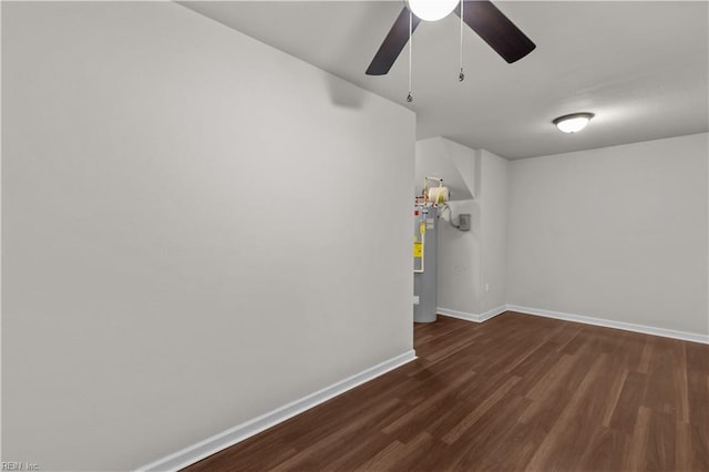 1102 Lakeview Cv, Smithfield, VA 23430 - spare room featuring ceiling fan, baseboards, dark wood-style flooring, and gas water heater