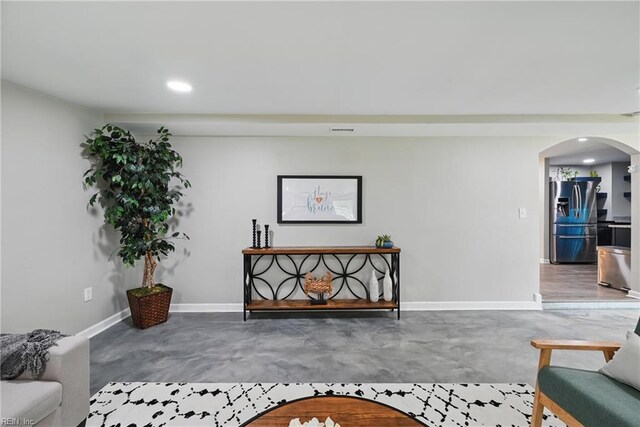 2007 Neville Cir, Hampton, VA 23663 - living room featuring arched walkways, finished concrete flooring, recessed lighting, and baseboards