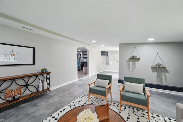2007 Neville Cir, Hampton, VA 23663 - living area with arched walkways, recessed lighting, finished concrete flooring, baseboards, and electric panel