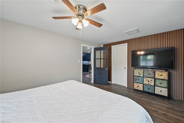 2007 Neville Cir, Hampton, VA 23663 - bedroom featuring wood finished floors, ensuite bathroom, a ceiling fan, and an accent wall