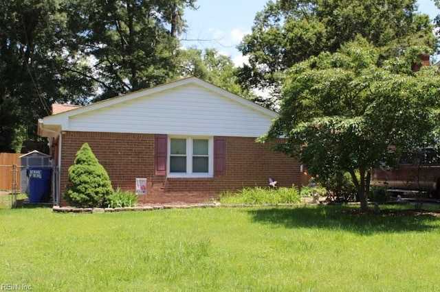 95 Kendall Dr, Newport News, VA 23601 - view of home's exterior featuring brick siding and a lawn