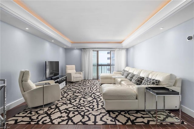 2830 Shore Dr Unit 1006, Virginia Beach, VA 23451 - living area featuring a tray ceiling, baseboards, and wood finished floors