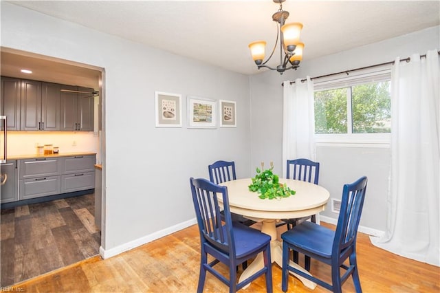 708 Houdon Ln, Virginia Beach, VA 23455 - dining area with wood finished floors, baseboards, and a chandelier